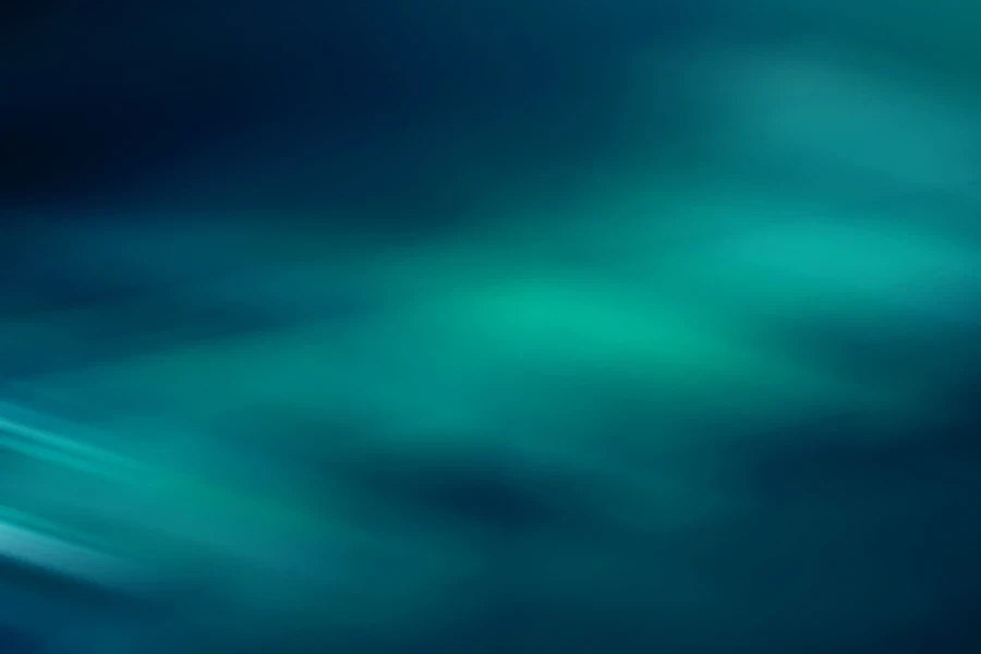A teal background with changing light