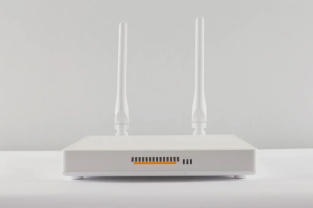 A white router with two antennas