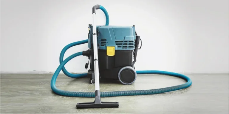 An industrial vacuum cleaner in an empty room