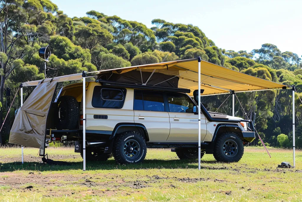 An off-road car with an awning stands on the grass