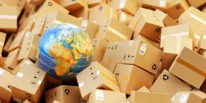 Background with heap of cardboard boxes, parcels and Earth globe