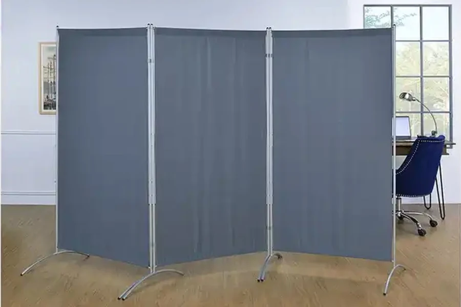 Basic three-panel standing metal and blue fabric room divider
