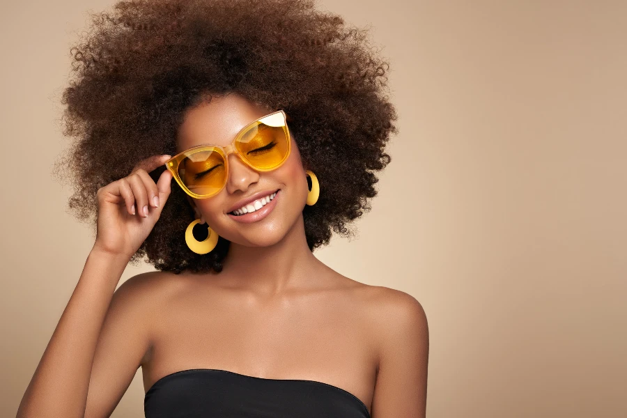 Beauty portrait of girl in colored sunglasses