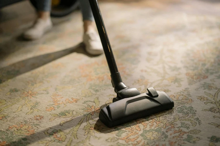 Black Vacuum Cleaner on Area Rug