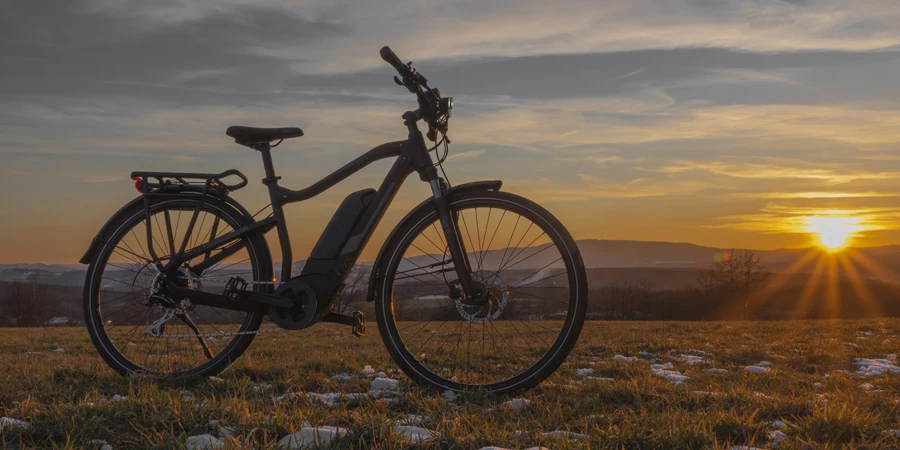 Black and gray electric bicycle in sunrise morning time