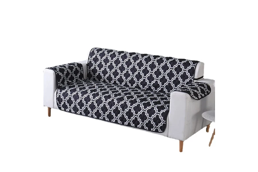 Black and white patterned, padded loose couch cover
