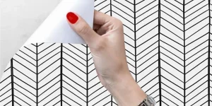 Black and white peel-and-stick wallpaper with geometric design