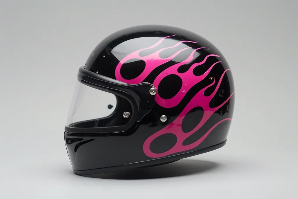 Black half helmet with pink flames sticker on the front
