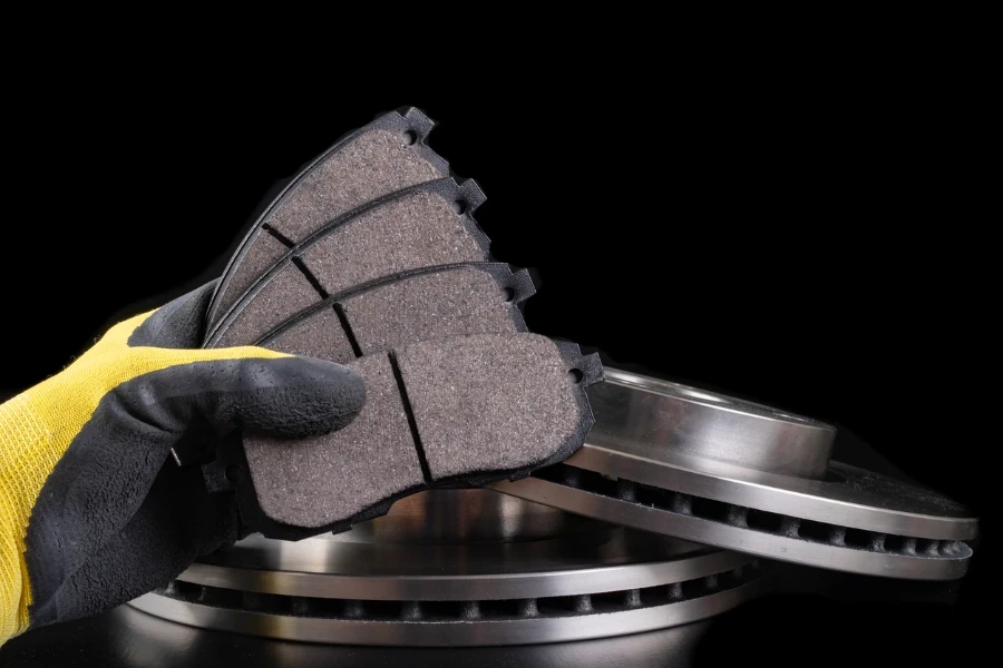 Brake pad for a passenger car in the hand of a mechanic