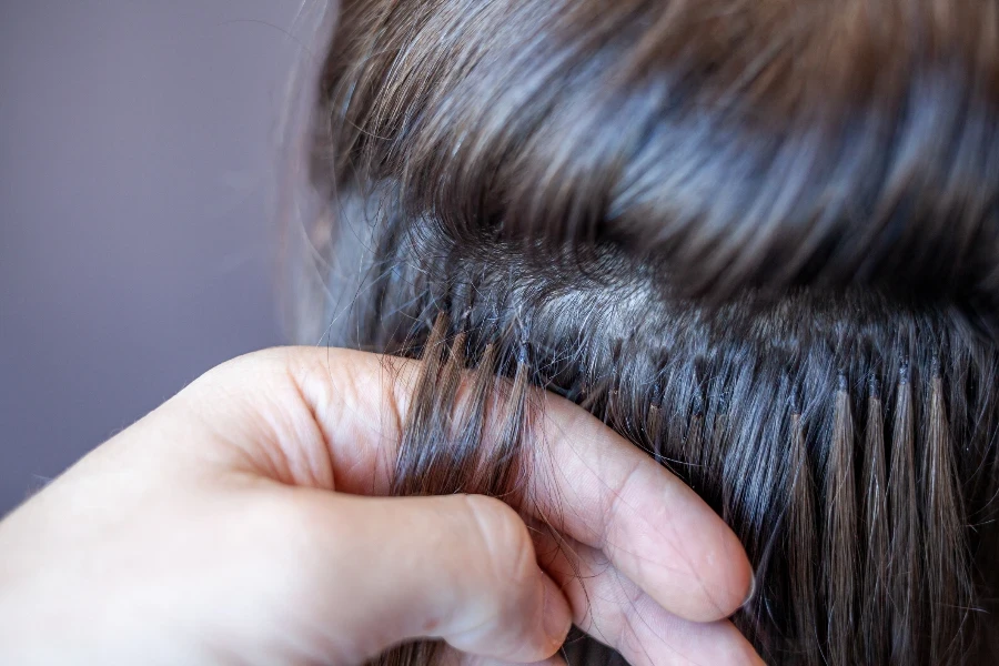 Bundles of hair extensions on a woman's head