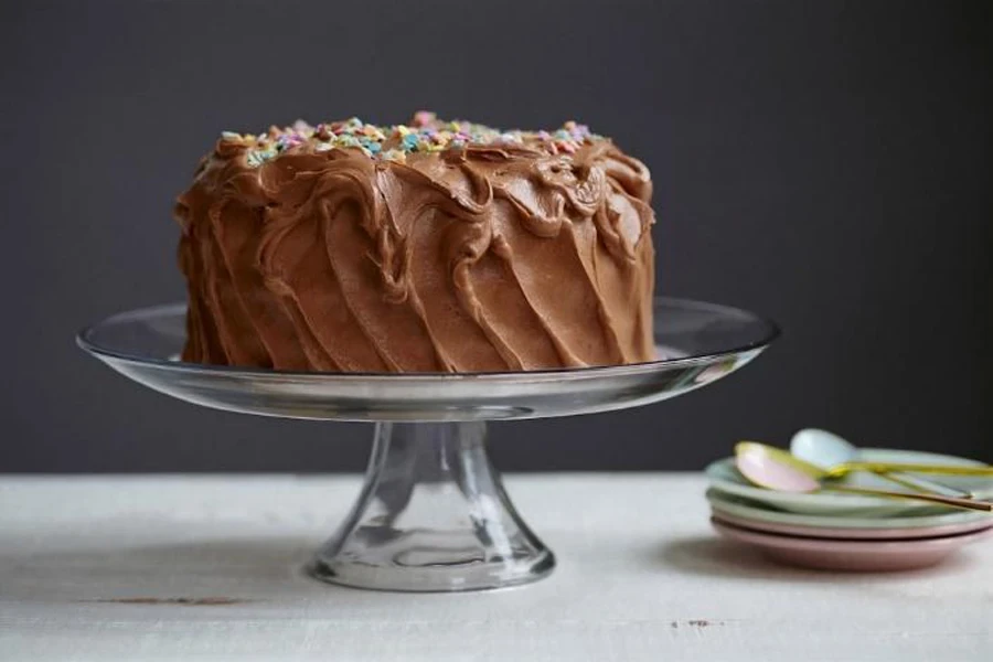 Chocolate cake on clear acrylic cake stand