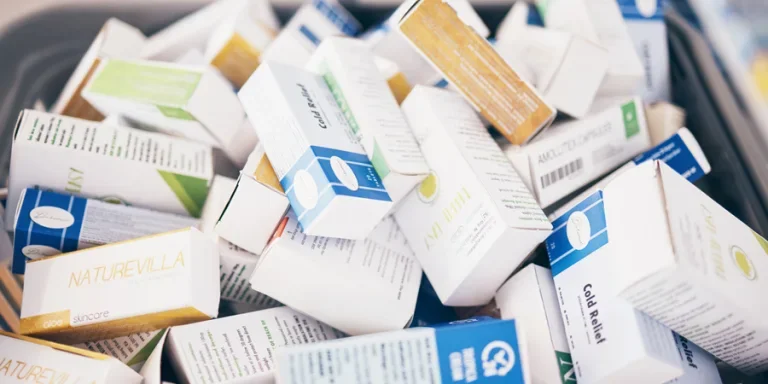 Closeup of medicine, boxes and shopping in pharmacy, drugstore service and consumer market