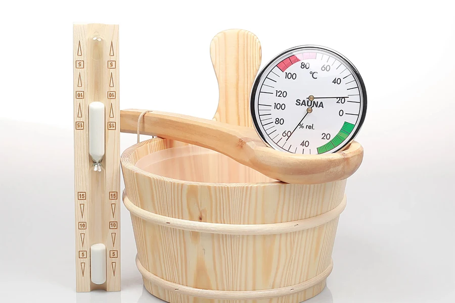 Digital sauna thermometer, sand timer, and wooden bucket and ladle