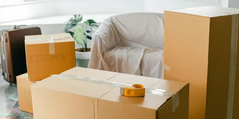 Empty apartment with packed carton boxes before moving