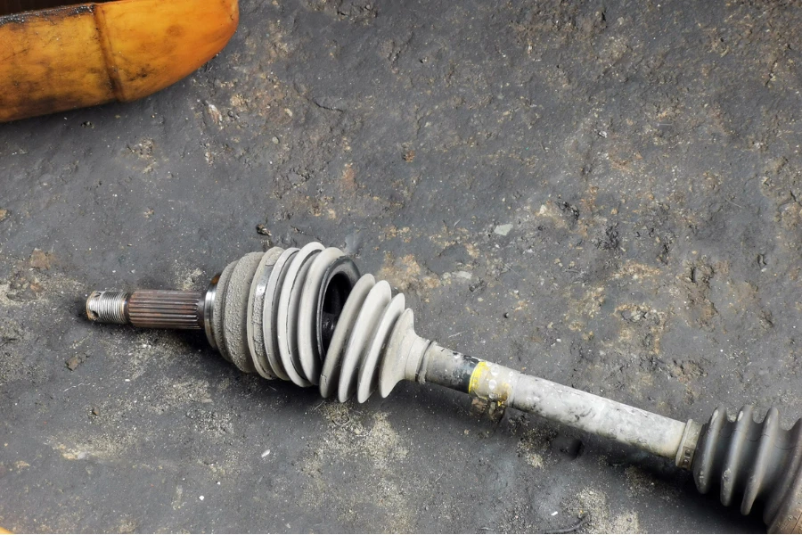 Image of damaged broken car CV axle boots on the ground