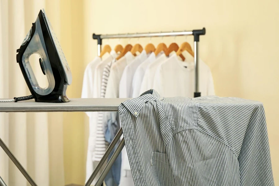 Ironing board with an iron and shirt on it