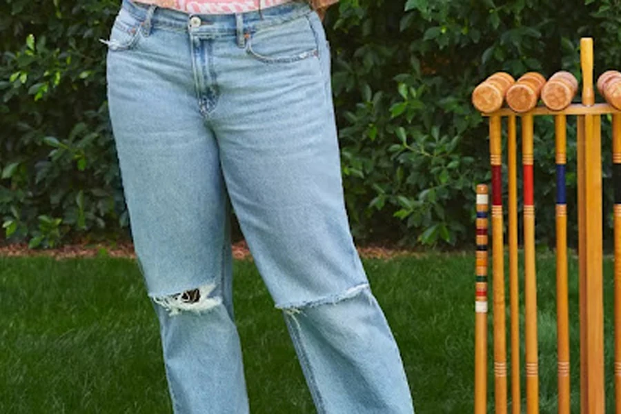 Lady posing in a pair of 90s straight jeans
