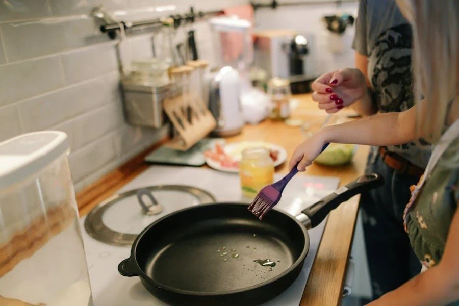 Lady preparing to use a frying pan