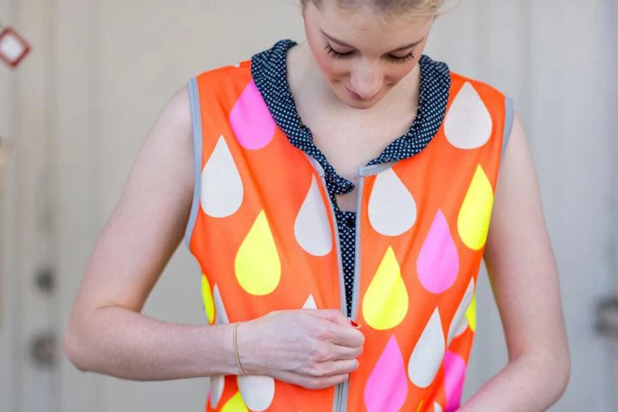 Lady showing off reflective gear for kids