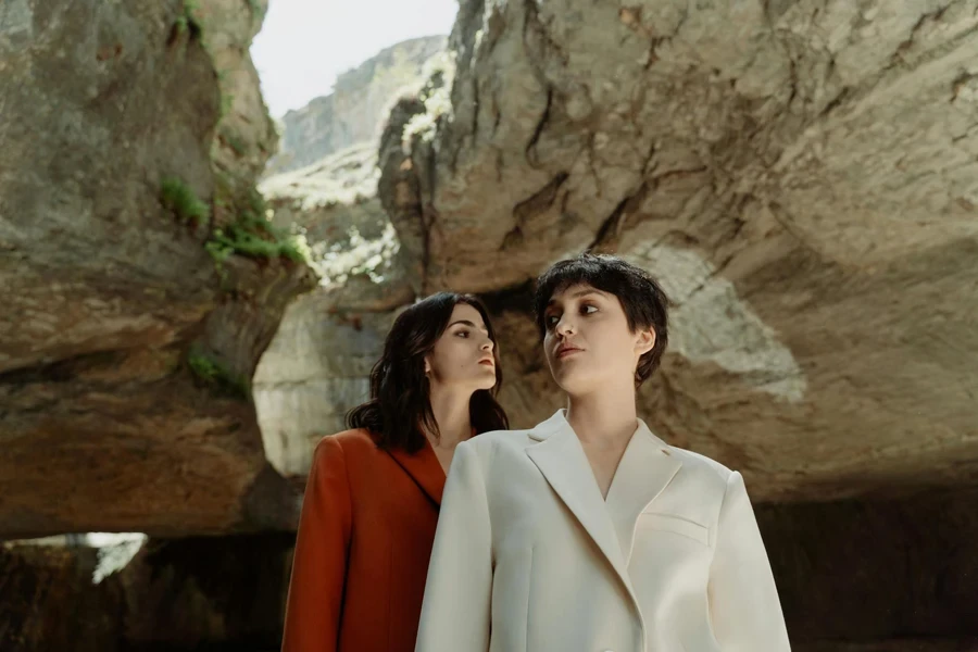 Low Angle Shot of Women wearing White and Orange Blazers 