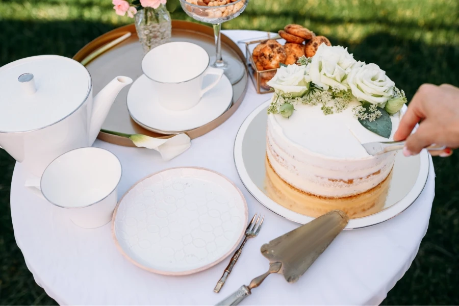 Luxury white teacup set with cake on the side