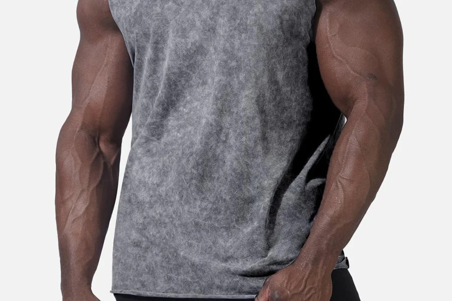 Man in an oversized gym shirt with a raw hem