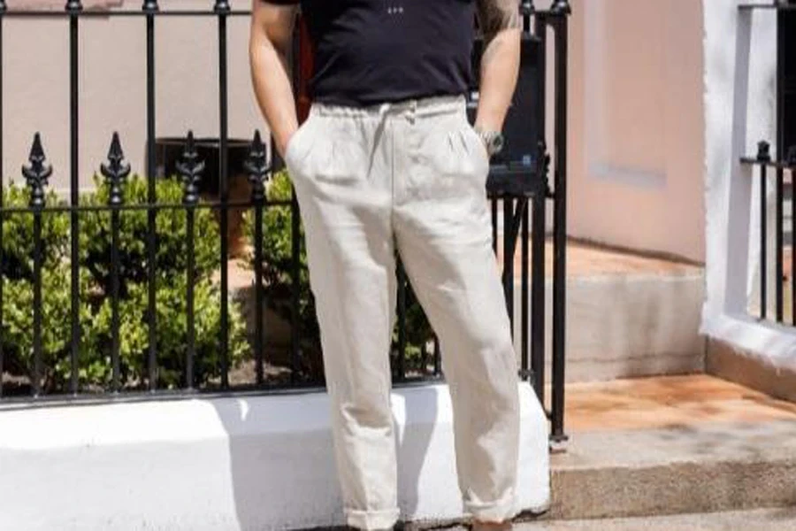 Man pocketing both hands in linen chinos pants