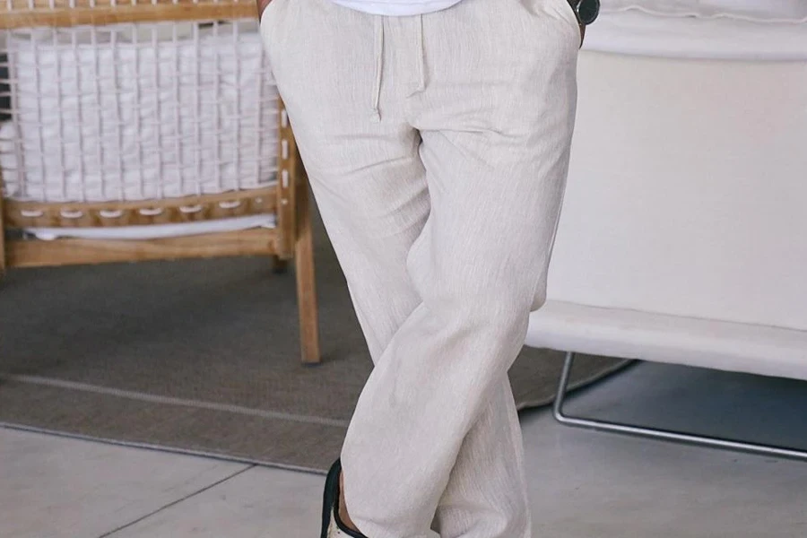 Man posing in linen pants with a wide-leg silhouette