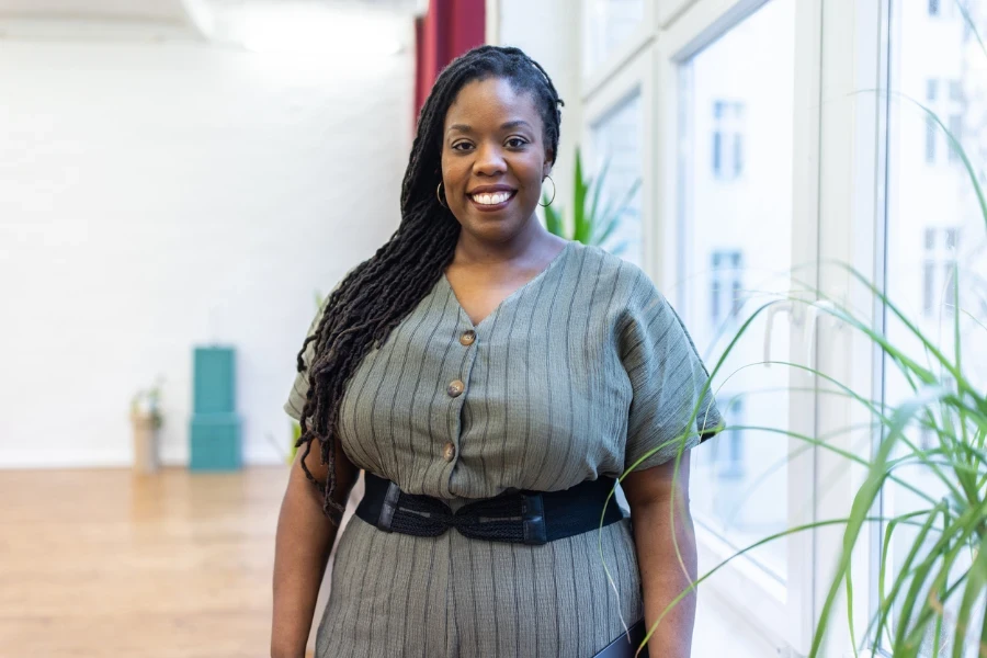 Mature female executive standing at office looking at camera