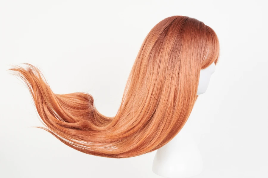 Natural looking ginger wig on white mannequin head