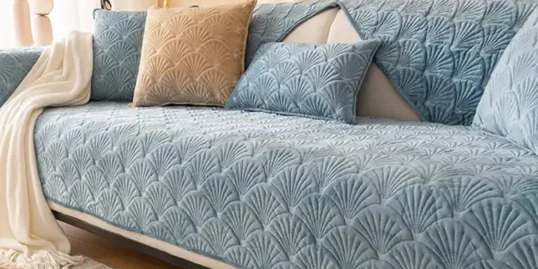 Pale blue patterned couch slipcover on a three-seater sofa