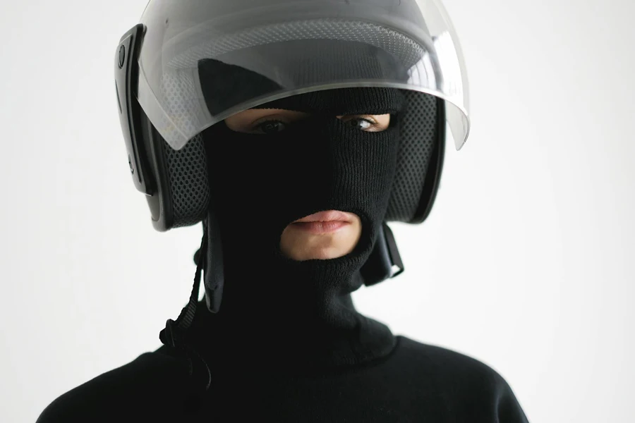 Person Wearing Black and White Helmet