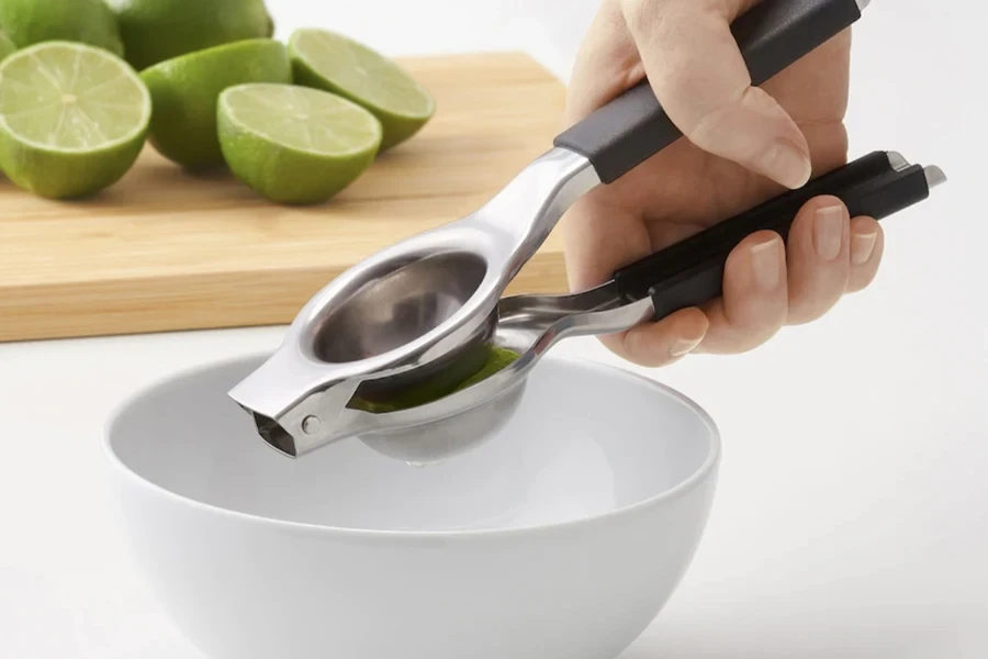 Person holding a lemon squeezer