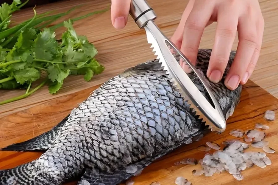 Person using a fish scaler