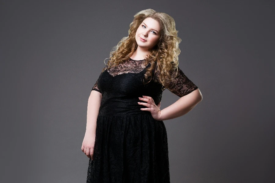 Plus size fashion model in black dress