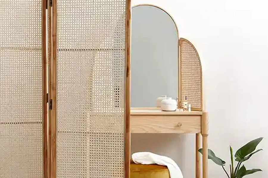 Rattan room divider creating zoning space in a bedroom