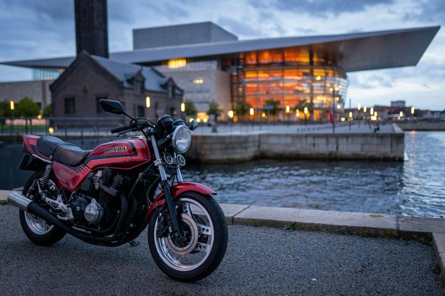 Red Motorcycle Parked on Side of Road