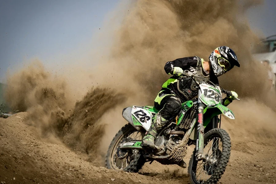 Rider Riding Green Motocross Dirt Bike