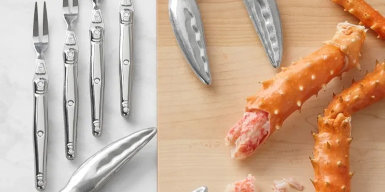 Seafood tools next to a lobster on a board