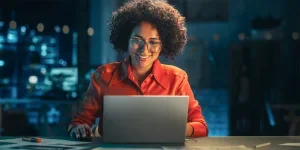 Smiling Women Looking at Computers