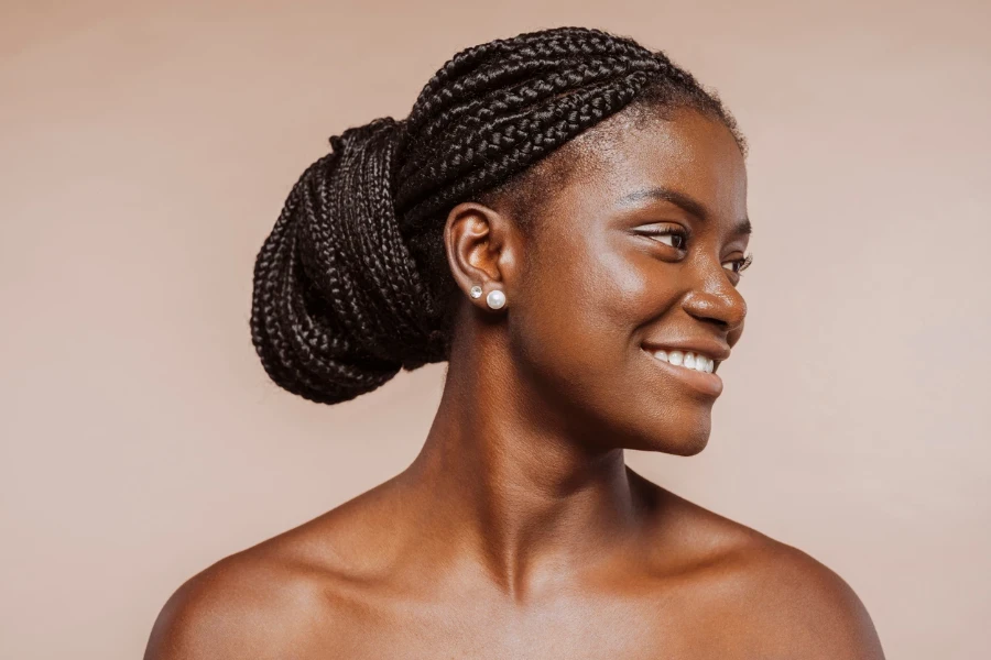 Smiling beautiful female with black braid hair