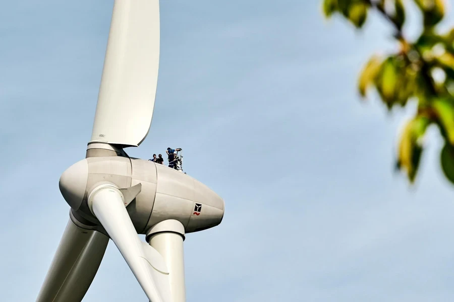 Technicians conducting maintenance on a wind turbine