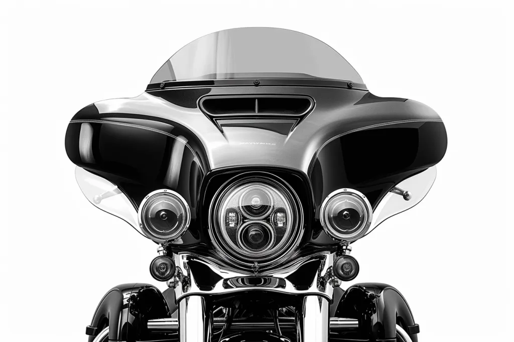 The motorcycle wind fairing with clear lens is shown in black