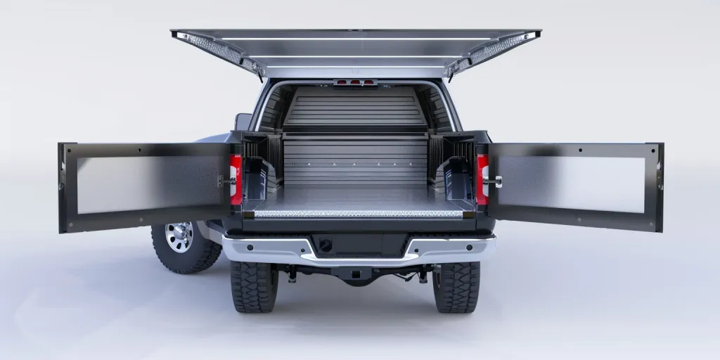 The truck bed is open and has an aluminum cargo box on the back of it against a white background