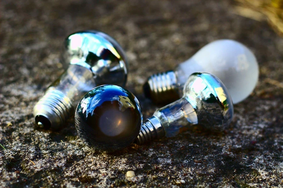 Three Light Bulbs on a Muddy Ground