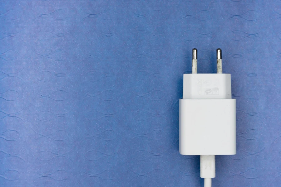 White Adapter on Blue Surface