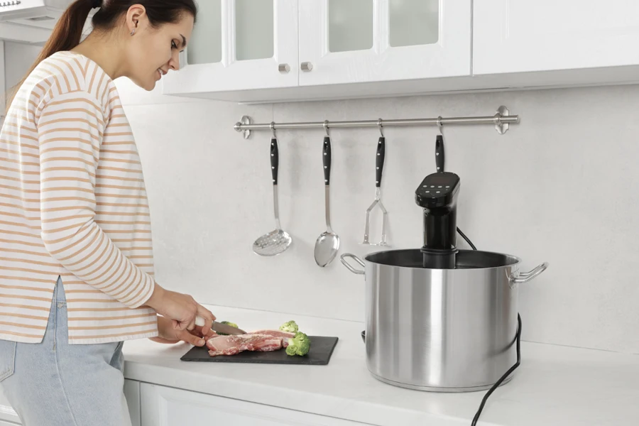 Woman in the kitchen using thermal cooker