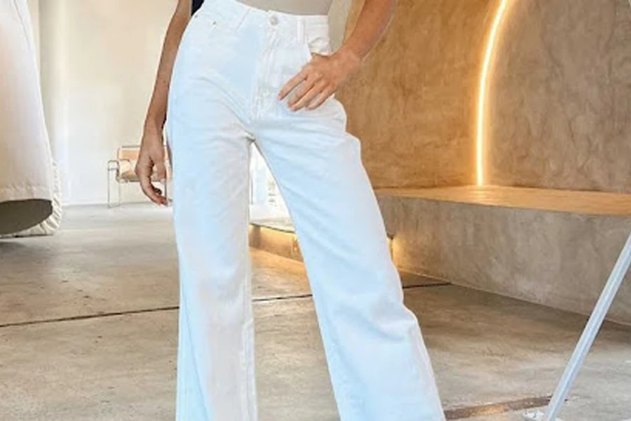 Woman wearing stylish white straight jeans