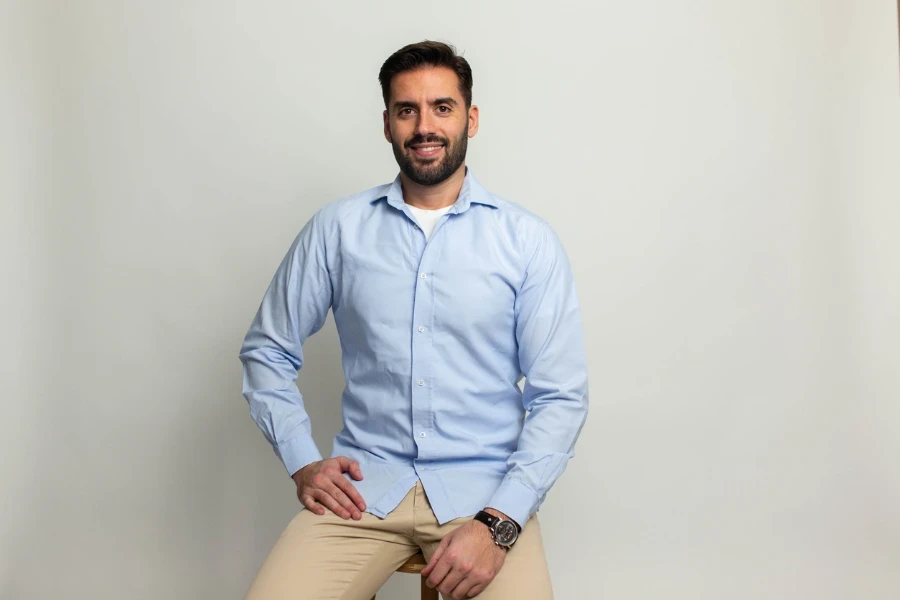 Young handsome business man dressed in casual denim shirt