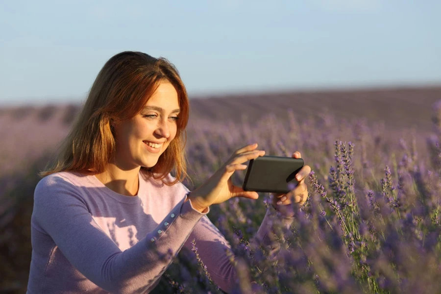 a beautiful woman shoots lavender flowers